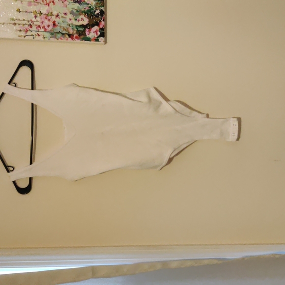 Source Unknown Tops - A white bodysuit. The brand is on noon